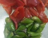 A picture of step 1 of Pickled cucumber & carrot accompanied with freshgreen & red chillies.