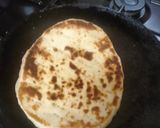 A picture of step 9 of Butter chicken served with buttered Naan bread.