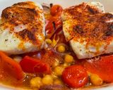 A picture of step 4 of Smokey Cod, Tomato and Chickpea Tray Bake.