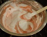 A picture of step 14 of Fresh Rasberry Cake Roll with Whipped White Chocolate Ganache Filling and Frosting.