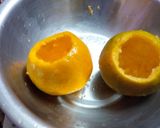 A picture of step 2 of Orange wedges icecream.