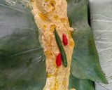 A picture of step 4 of Pabda Paturi (with Taro/ kochu/Alvi leaves) and Pabda Bhappa.