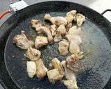 A picture of step 2 of Valencian Paella with Rabbit and Chicken.