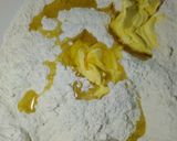 A picture of step 2 of Coconut mandazis.