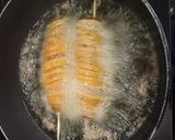 A picture of step 7 of Tornado Potatoes.