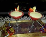 A picture of step 6 of Pinacolada and strawberries mocktail.