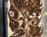 A picture of step 9 of Vanilla bean ice cream with ginger biscuits, caramel and chocolate.