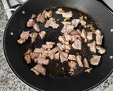 Foto del paso 4 de la receta: Arroz meloso de piquillos confitados y costillas de cerdo