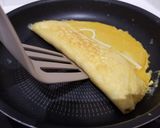 Une image de l'étape 13 de Tamagoyaki (omelette japonaise sucrée).
