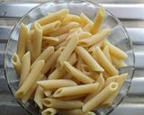 A picture of step 1 of Penne pasta in white sauce (with fresh cream and cheese).