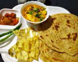 A picture of step 6 of Dum paneer handi masala with Lachha Paratha.