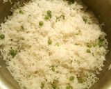 A picture of step 7 of Boiled white rice with green peas 🍚☺.