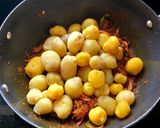 A picture of step 7 of Baby Potato Korma.