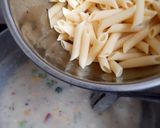 A picture of step 5 of Cheesy and Creamy veggie white sauce penne pasta (with fresh cream, cheese and seasonings).