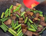 A picture of step 5 of Stir-Fried Garlic Scapes with Pork Belly.