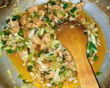A picture of step 6 of Red Chilli Capsicum Rice.