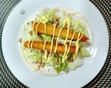 Foto del paso 4 de la receta: Taco de finger de pollo con salsa de mango y curry