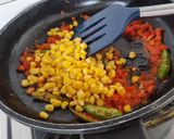 A picture of step 3 of Corn capsicum paneer in yellow gravy using premix.