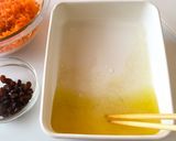 A picture of step 3 of Carrot Rape with Raisins.