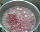 A picture of step 8 of Hibiscus Thai rice balls dunk in coconut milk.