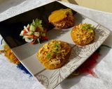 A picture of step 7 of Patacones or Tostones with minced chicken topping.