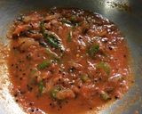 A picture of step 5 of Chatpata Bread Upma in red sauce.