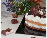A picture of step 4 of Vanilla & Kinder Number Cake.