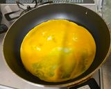 A picture of step 5 of Omu-Okonomiyaki (Japanese as-you-like pancake wrapped with egg).