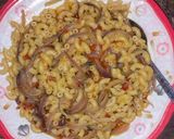 A picture of step 1 of Jollof macroni with sliced onion.