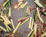 A picture of step 1 of Spaghetti with speck, courgette and pumpkin flowers.