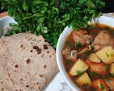 A picture of step 9 of Aloo chicken.