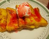 A picture of step 3 of French toast with strawberry syrup and cream 🍽️.