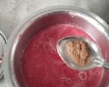 A picture of step 3 of Red Fruity Juicy Popsicles.