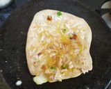 A picture of step 2 of Egg Cheese Paratha with curd.