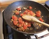 A picture of step 2 of Sig's Tomato and potato mash filled potato boats.