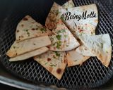 A picture of step 6 of Spicy Makhani Dip with Naan Chips.