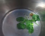 A picture of step 2 of Cardamom and tulsi tea.