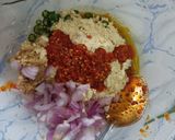 A picture of step 4 of Littichokha with baigan chutney and fried chilli onions.