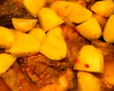 A picture of step 3 of Chicken in spicy coconut gravy with potatoes #WYH (VERY SPICY).