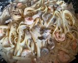 A picture of step 5 of Creamy Shrimp and Mushroom Fettuccine.
