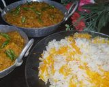 A picture of step 7 of Dam allu with colourful zeera rice.
