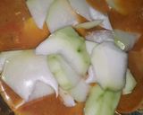 A picture of step 7 of Gaeng Som with Shrimp and Green Papaya.