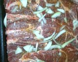 A picture of step 2 of Bake pork steak with onions .