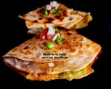 A picture of step 4 of Aloo Matar Tikki Paneer Schezwan Tortilla Quesadilla.