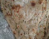 A picture of step 5 of No meat Tikkie stuffed naan with mayo-ketchup layering.