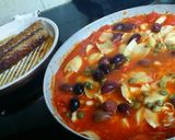 A picture of step 4 of Grilled Sausage and Cannellini Beans Puttanesca w/ Garlic Bread.