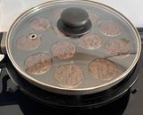 A picture of step 10 of Healthy Atta Jaggery Muffins in Appe Pan.