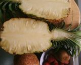 A picture of step 1 of Fruit salad in a pineapple boat.
