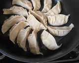 A picture of step 7 of Japanese pan fried dumplings with pork, napa cabbage and spring onion 🥟 - Gyoza.