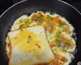 A picture of step 2 of Cheesy omelet with 🍞 bread.